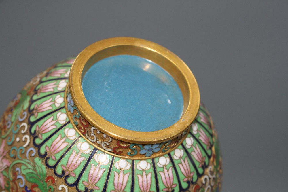 A Chinese champleve enamelled gilt brass vase, decorated with flowers, height 23cm